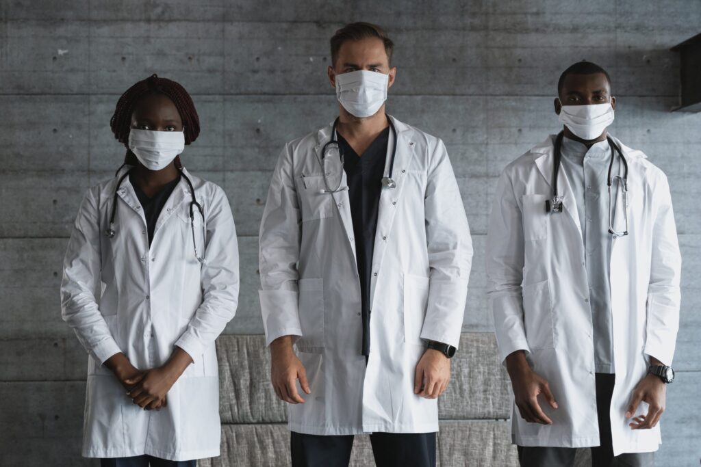 Doctors in White Coat Wearing Face Masks
